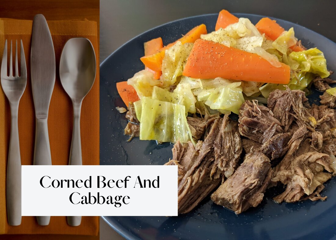 Fork, knife, and spoon next to a plate of corned beef and cabbage